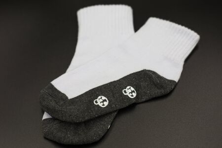 One pair of socks on a black background.の写真素材