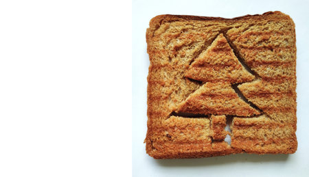 Concept of Christmas morning breakfast meal. Funny christmas tree toasted brown bread for kids. Fun...
