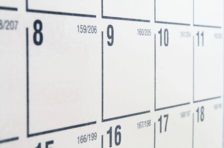 White paper calendar with black numbers and gridの写真素材