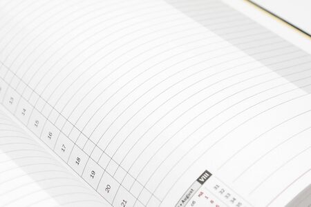 White lined diary page with black numbersの写真素材