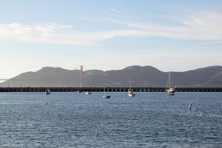 A seascape with boats and view on Golden Gate Bridgeの写真素材