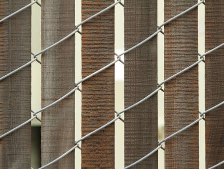 Closeup photo of wooden fence with wireの写真素材