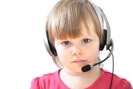 Cute toddler girl with a headset over white backgroundの写真素材