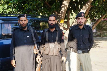 Unidentified 3 policemen at the hotel in  Besham, Pakistanのeditorial素材