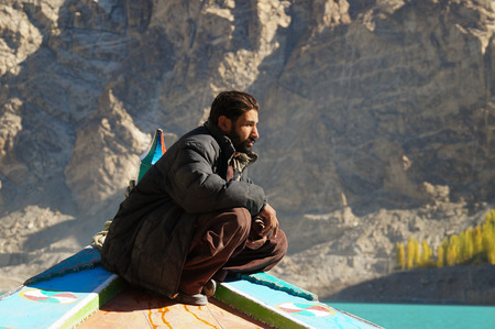 Pakistani man at the boat,Attabad Lake,Northern Pakistanのeditorial素材