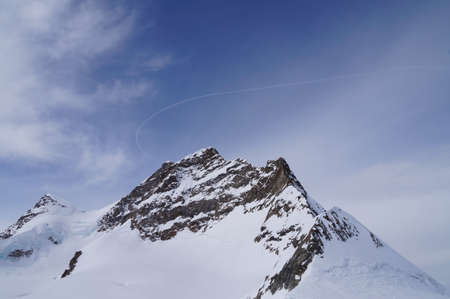 Snow mountain and blue sky at Jungfraujoch in Switzerlandの写真素材
