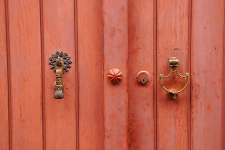 Metal door knocker for man and woman in Iran.Door knocker  on the right is for woman,the left is for man.の写真素材