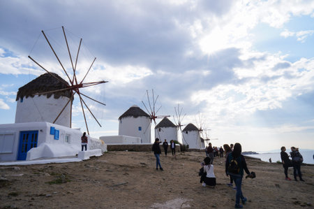 Mykonos,Greece- April 11,2016:Unidentified tourists visit windsmills in Mykonos, Greece.