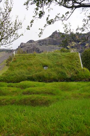 Hofskirkja church is a beautiful turf church in South-East Iceland. There are only 6 turf churches remaining in Iceland and Hofskirkja is the last of the old churches to be built in this beautiful turf style.の写真素材
