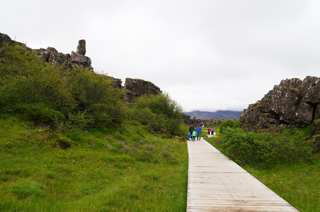 Thingvellir National Park, Iceland - 5 July 2017: Unidentified tourists walking in Thingvellir National Park, Iceland.のeditorial素材