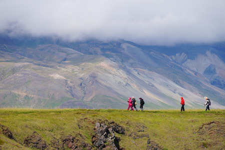 Snaefellsness peninsula,Iceland- 26 June 2017: Unidentified tourists walking back from visit Gatklettur Stone Arch at Snaefellsnes Peninsula, Icelandのeditorial素材