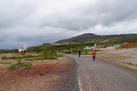 Strokkur Geysir, Iceland- 5 July 2017: Unidentified tourists walking to see Strokkur Geysir in Icelandのeditorial素材