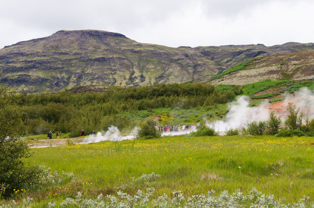 Strokkur Geysir, Iceland- 5 July 2017: Unidentified tourists waitng for eruption of Strokkur Geysir in Icelandのeditorial素材