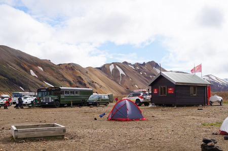 Landmannalaugar,Iceland- 2 July 2017: Unidentified tourists sitting by the bus at national park Landmannalaugar in Iceland.のeditorial素材