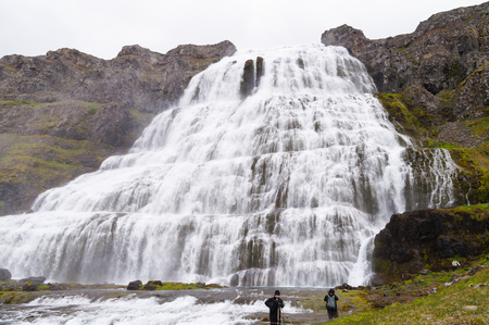 West Fjords,Iceland- 27 June 2017: Unidentified tourists taking picture at Dynjandi Waterfall,Iceland.のeditorial素材