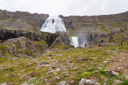 West Fjords,Iceland- 27 June 2017: Unidentified tourists taking picture of Dynjandi Waterfall,Iceland.のeditorial素材