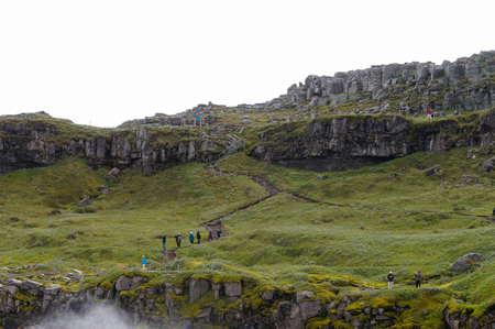 Dettifoss,Iceland- 30 June 2017: Unidentified tourists walking back from visiting Dettifoss in summer, Iceland.のeditorial素材