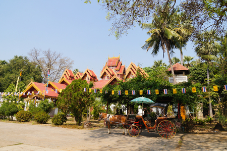 Wat Sri Rong Muang and horse carriage in Lampang,Northern Thailand.のeditorial素材