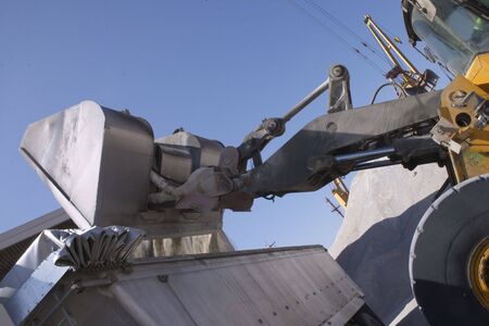 View of a Back Hoe loading a truckの写真素材