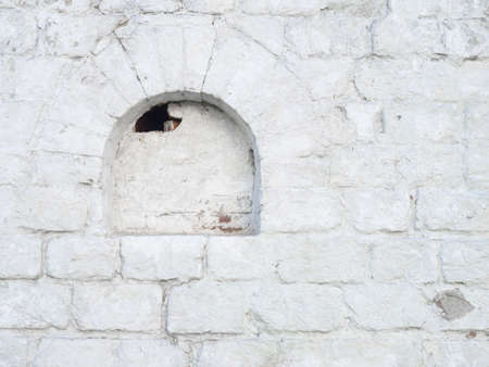 Old white brickwork. Loophole in the Kremlin wallの写真素材