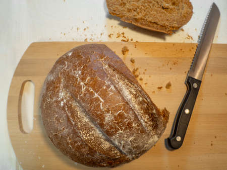 Cut rye bread lies on the board. Fresh bakeryの写真素材