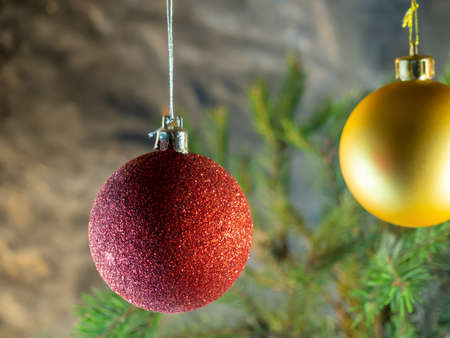 red Christmas ball on the background of fir branches. Christmas decorationの写真素材
