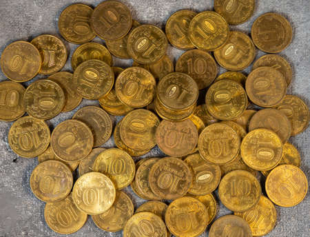 A scattering of coins. A pattern from money. Coin backgroundの写真素材