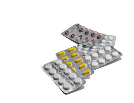 Pills on a white background. Various medicines in packages.の写真素材