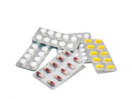 Pills on a white background. Various medicines in blisters.の写真素材