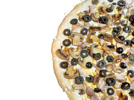 Homemade pizza with mushrooms, chicken and olives on a white plateの写真素材