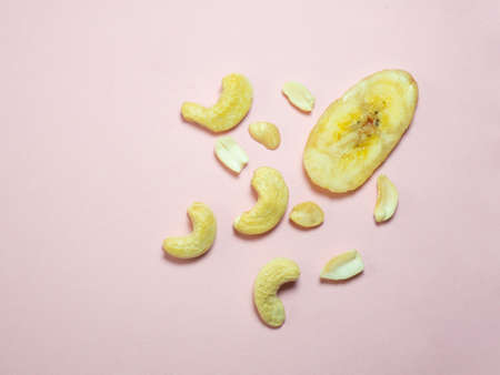 Dried fruits on the table. Pink background. Nutsの写真素材