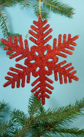 Red snowflake on the tree. New Year's decorationの写真素材