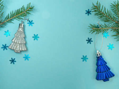 New Year card. Christmas card on a blue background. Fir branches. Decorations for the holiday.
Fir branches, red beads. Cristmas trees. Christmas toysの写真素材