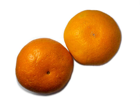Two ripe tangerines on a white background. Whole juicy fruits.の写真素材