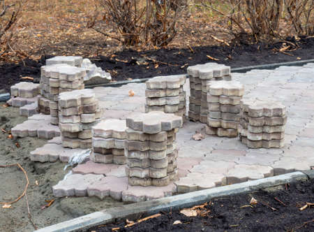 Laying paving slabs on the street. The working processの写真素材