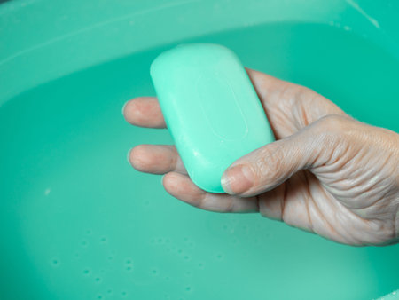 Hand washing. Toilet soap in hand. Green soap. Hand washing. Hygiene.の写真素材