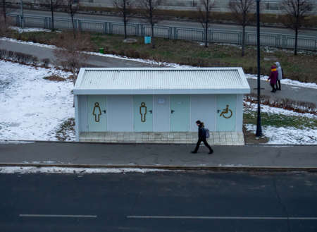 outdoor toilet. Toilet cubicle design. Paid water closet. Man and woman icon. Public toiletの写真素材