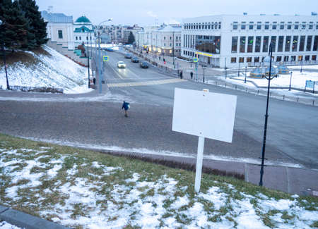 Space to fill over the cityscape. Road sign, street sign.  mock-up. Blank plate for inscriptionの写真素材