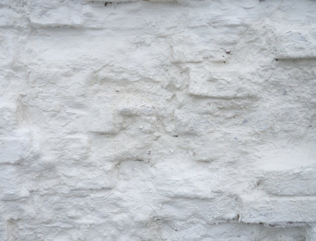 Old, uneven masonry. Wall pit, whitewashed brick, ancient brickworkの写真素材