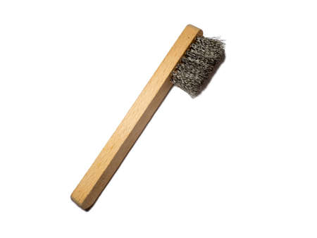 Brush with metal bristles and a handle for technical needs. Metal cleaning tool.の写真素材