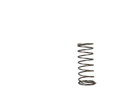 Metal spring on a white background. Mechanism element.の写真素材