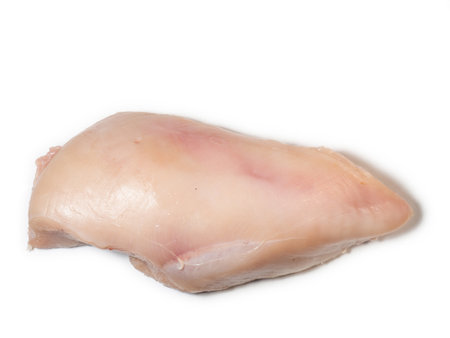 Chicken breast on a white plate. Chicken meat isolate. Diet food. Fresh pink poultry meat.の写真素材