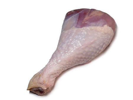Turkey drumstick  in spices  on white background. Poultry meat. Turkey leg. Juicy meat is waiting to be cooked. Waiting for the oven. Hamの写真素材