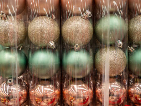 Christmas decorations in a box.   Preparing to dress up the Christmas tree. Bright decorations. Shop counter.の写真素材