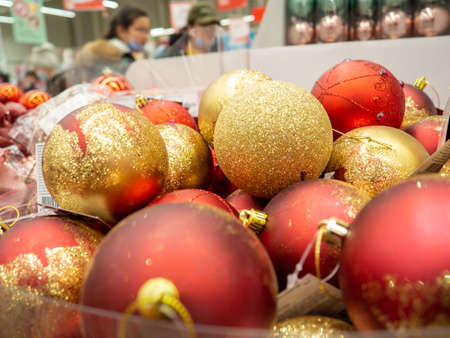 Christmas decorations in the store. Sale of gifts. Good New Year spirit. Toys for the Christmas tree. Background from ballsの写真素材