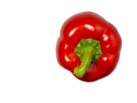 Red bell pepper on a white background. A healthy vegetable in droplets of water. Farm harvest. Sweet Pepper Isolateの写真素材