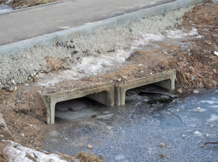 waste water system. Ice-covered water. Bad ecologyの写真素材