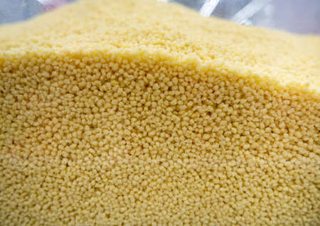 Couscous groats. Grains background. In the store on the showcase. Healthy food. Porridge ingredientの写真素材