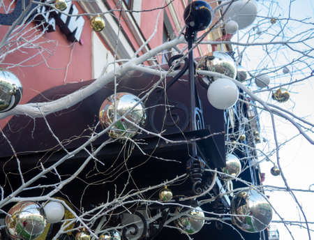Christmas tree at the store. New Year's decoration on the street. Holiday atmosphereの写真素材