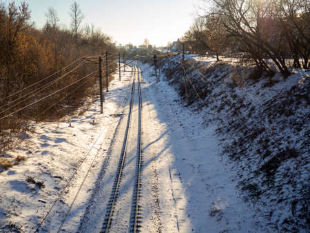 Railroad tracks in the snow. Train track. Railway in winterの写真素材